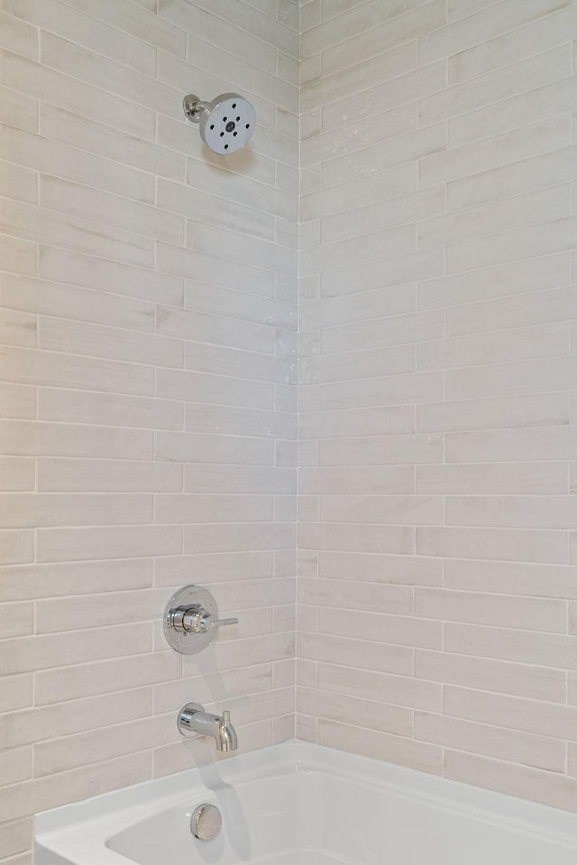 full bathroom with shower / washtub combination
