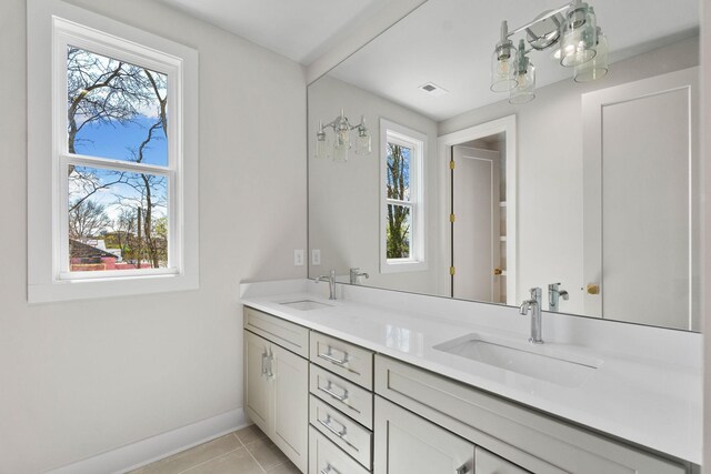 full bathroom featuring a wealth of natural light and a sink