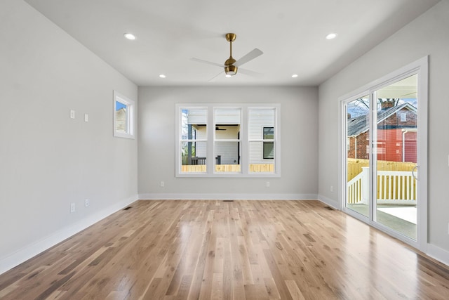 spare room featuring baseboards, light wood-style flooring, ceiling fan, and recessed lighting