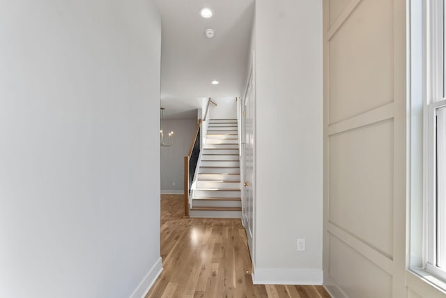 interior space with recessed lighting, baseboards, and wood finished floors