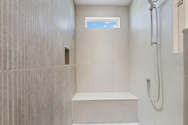 bathroom featuring a tile shower