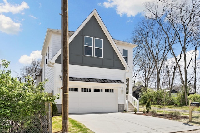 view of front of property with an attached garage and concrete driveway