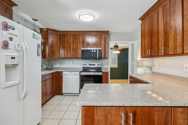 3132 Stafford Dr, Nashville, TN 37214 - kitchen with light tile patterned flooring, a ceiling fan, light stone countertops, appliances with stainless steel finishes, and a peninsula