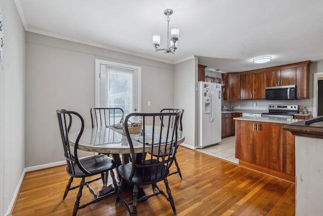 3132 Stafford Dr, Nashville, TN 37214 - dining room with baseboards, light wood-style floors, and ornamental molding