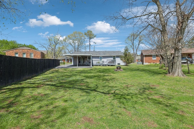 3132 Stafford Dr, Nashville, TN 37214 - back of property featuring a lawn, fence, and an attached carport
