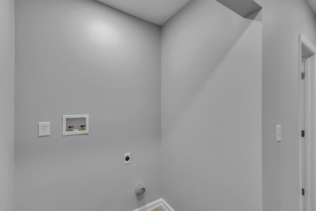 laundry area with laundry area, hookup for an electric dryer, and hookup for a washing machine