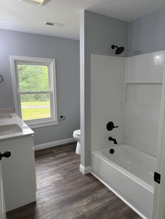 135 Locust Dr, Erin, TN 37061 - full bathroom with shower / bath combination, double vanity, and wood finished floors