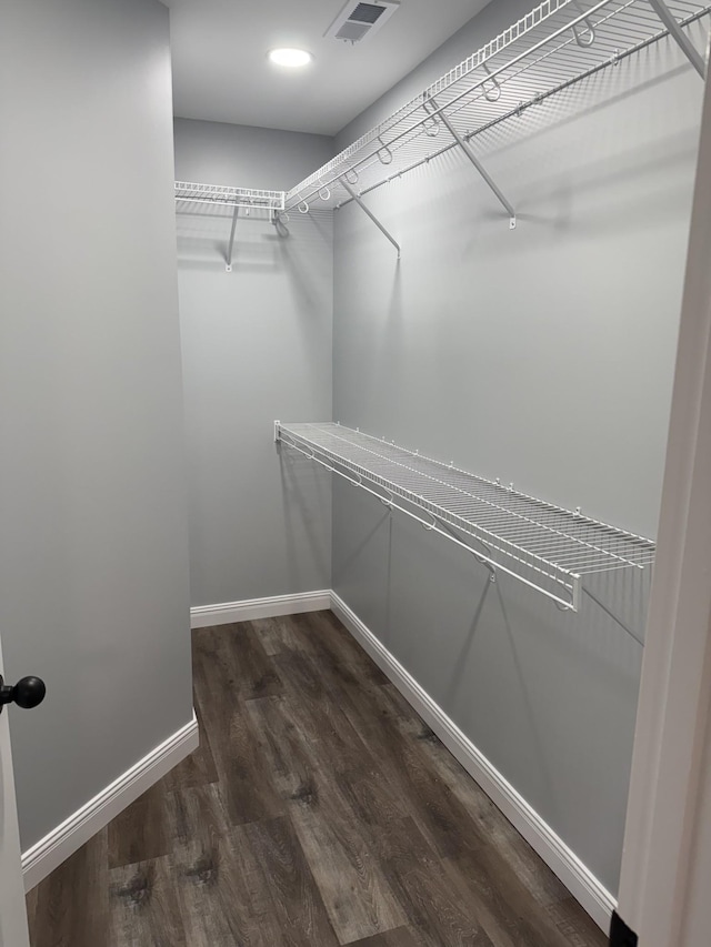 135 Locust Dr, Erin, TN 37061 - walk in closet featuring wood finished floors