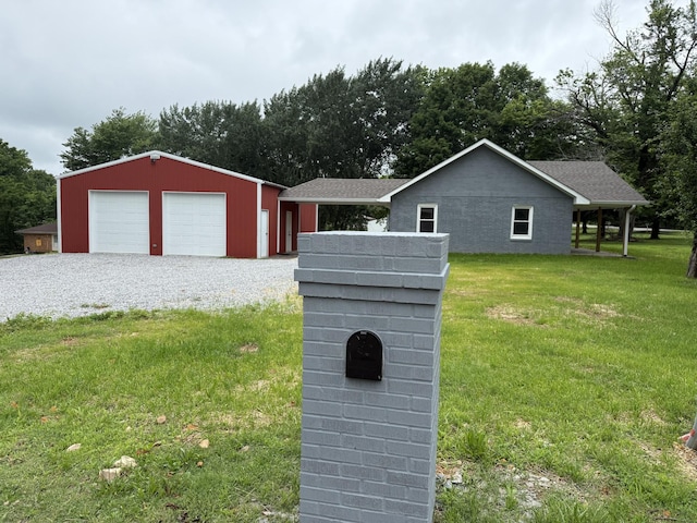 135 Locust Dr, Erin, TN 37061 - view of front of home featuring an outbuilding, a front lawn, and a detached garage