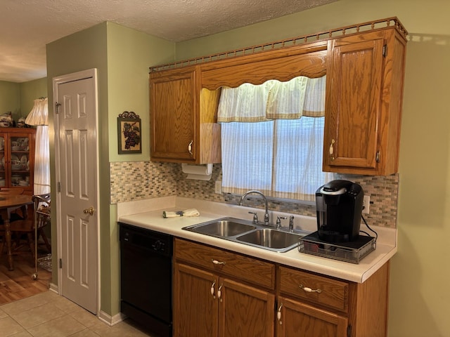 1701 Jamie Dr, Columbia, TN 38401 - kitchen featuring light countertops, tasteful backsplash, dishwasher, and a sink