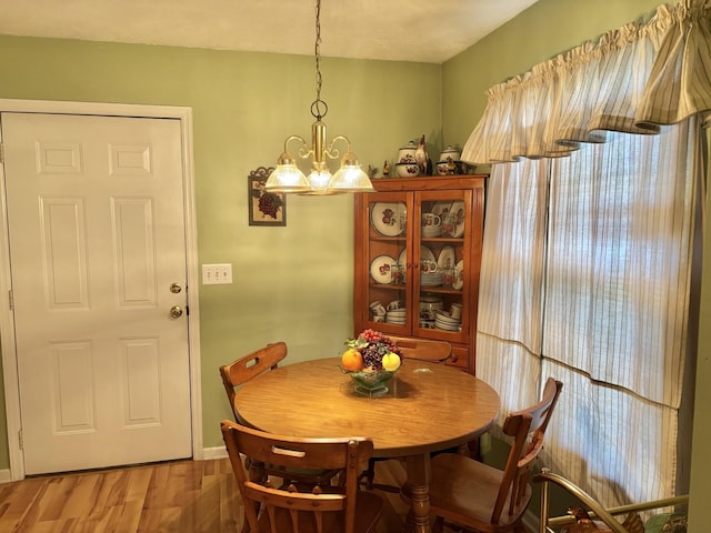 1701 Jamie Dr, Columbia, TN 38401 - dining room featuring a notable chandelier, light wood-style floors, and baseboards