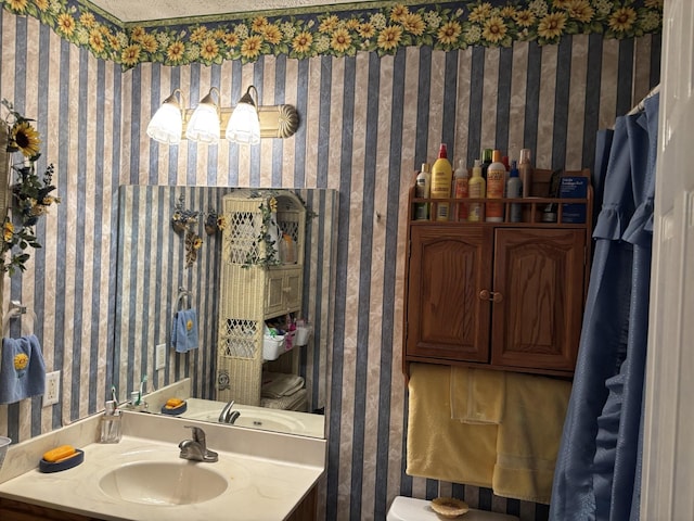 1701 Jamie Dr, Columbia, TN 38401 - bathroom with toilet, wallpapered walls, and vanity