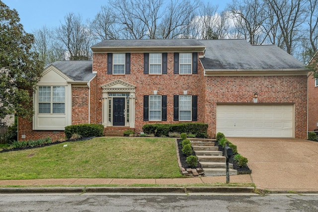 513 Cold Stream Pl, Nashville, TN 37221 - view of front of property featuring brick siding, a shingled roof, a front lawn, and concrete driveway