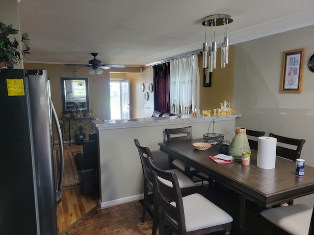 1148 Brittany Park Ln, Antioch, TN 37013 - dining room featuring a textured ceiling, crown molding, and a ceiling fan