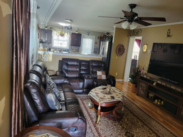 1148 Brittany Park Ln, Antioch, TN 37013 - living area featuring a ceiling fan, crown molding, and wood finished floors