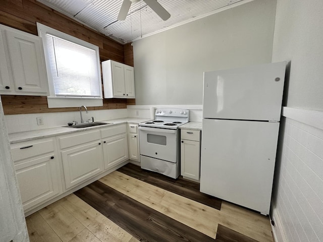 347 E Washington St, Pulaski, TN 38478 - kitchen with white appliances, wood-type flooring, ceiling fan, white cabinets, and wainscoting
