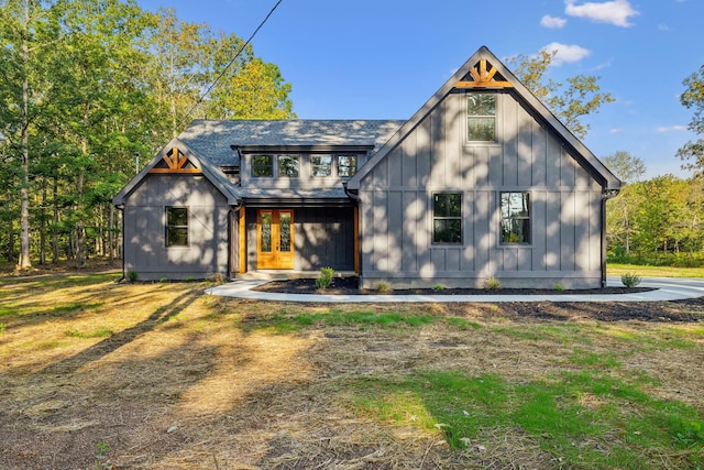 view of front of property with board and batten siding and french doors