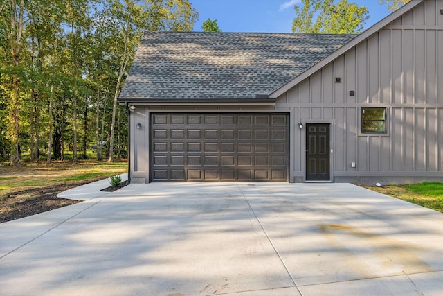 garage featuring concrete driveway