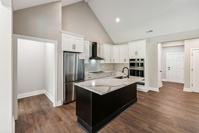 kitchen with a sink, white cabinets, wall chimney range hood, and stainless steel appliances