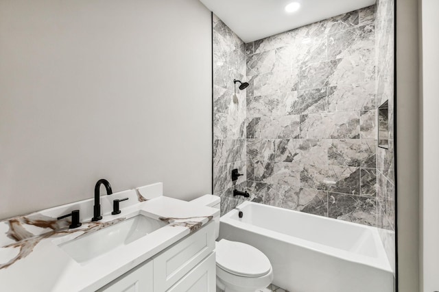 full bath featuring toilet, vanity, and shower / bath combination