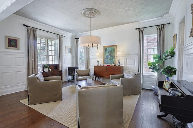 living room with plenty of natural light and ornamental molding