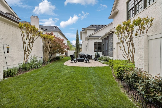 view of yard with fence and a patio