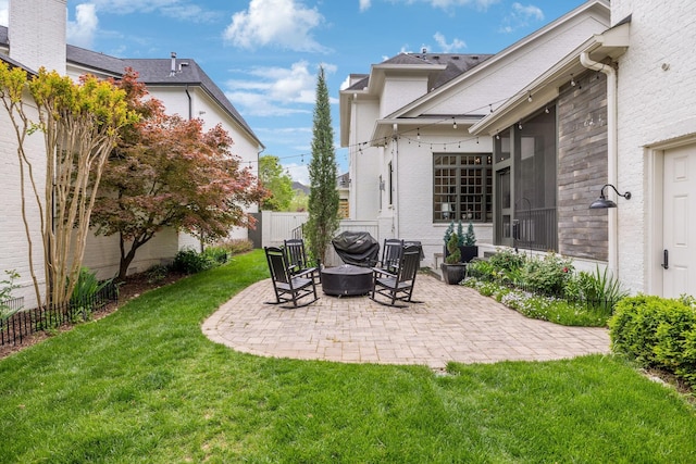 exterior space featuring fence and an outdoor fire pit