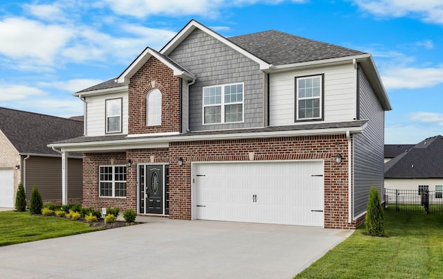 2539 Rafiki Dr, Clarksville, TN 37042 - view of front of property with driveway, brick siding, a garage, and a shingled roof