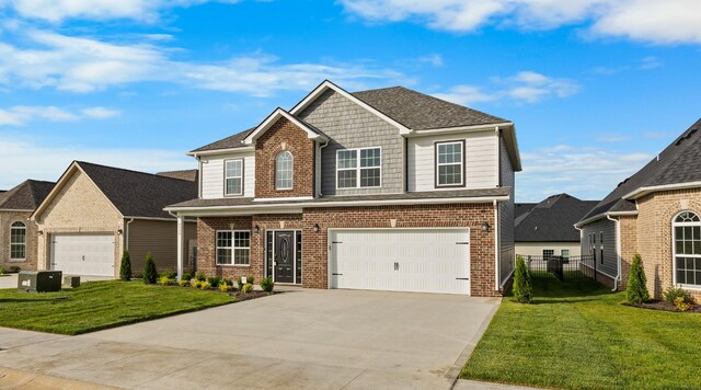 2539 Rafiki Dr, Clarksville, TN 37042 - view of front of house featuring brick siding, concrete driveway, and an attached garage