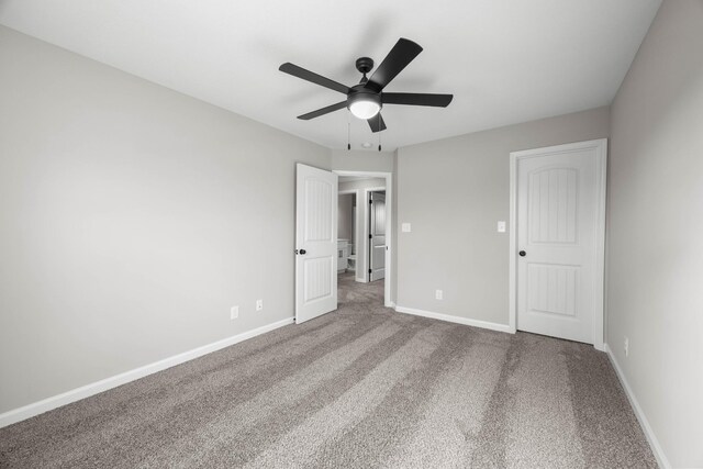 2539 Rafiki Dr, Clarksville, TN 37042 - unfurnished bedroom featuring carpet, baseboards, and a ceiling fan