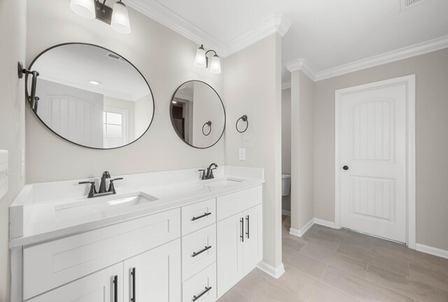 2539 Rafiki Dr, Clarksville, TN 37042 - full bath featuring ornamental molding, double vanity, baseboards, and toilet