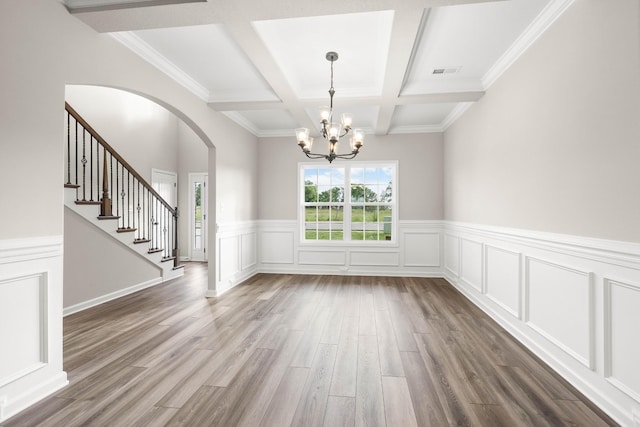 2539 Rafiki Dr, Clarksville, TN 37042 - unfurnished dining area with a chandelier, beam ceiling, arched walkways, dark wood finished floors, and coffered ceiling