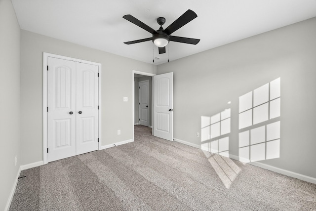 2539 Rafiki Dr, Clarksville, TN 37042 - unfurnished bedroom featuring carpet, a closet, baseboards, and ceiling fan