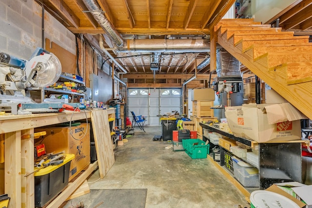 garage featuring a workshop area and a garage door opener