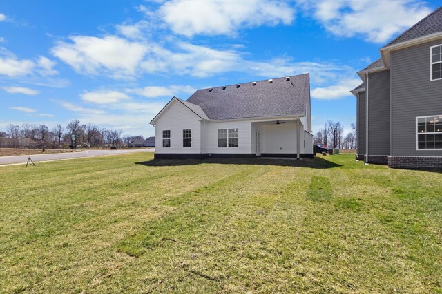 2531 Rafiki Dr, Clarksville, TN 37042 - rear view of house with a lawn and roof with shingles
