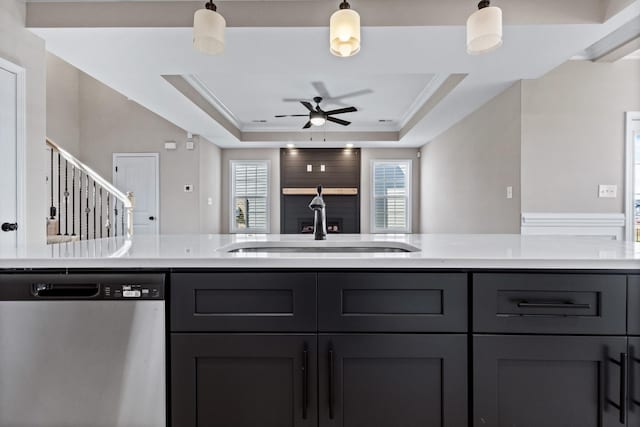 2531 Rafiki Dr, Clarksville, TN 37042 - kitchen featuring ceiling fan, a healthy amount of sunlight, stainless steel dishwasher, and a raised ceiling