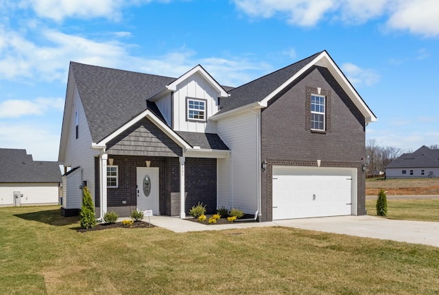 2531 Rafiki Dr, Clarksville, TN 37042 - traditional-style house with a garage, brick siding, a front lawn, board and batten siding, and driveway