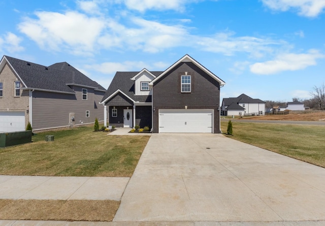 2531 Rafiki Dr, Clarksville, TN 37042 - view of front facade featuring driveway, a front yard, an attached garage, and brick siding