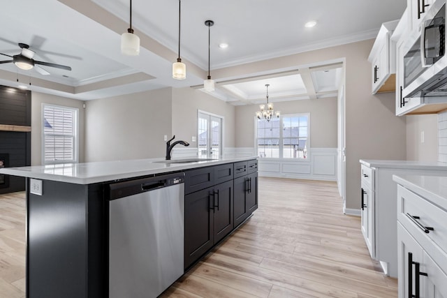 2531 Rafiki Dr, Clarksville, TN 37042 - kitchen with light countertops, a sink, stainless steel appliances, plenty of natural light, and ceiling fan with notable chandelier