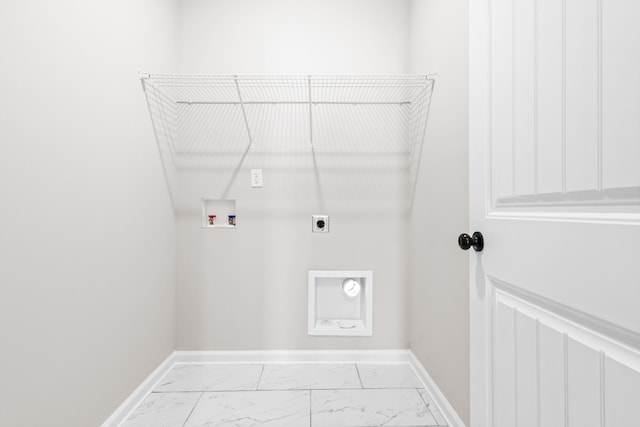 2531 Rafiki Dr, Clarksville, TN 37042 - clothes washing area with hookup for an electric dryer, hookup for a washing machine, baseboards, marble finish floor, and laundry area