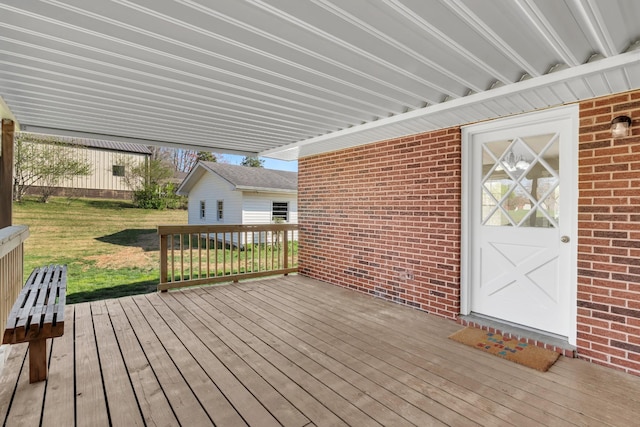 wooden deck with a yard