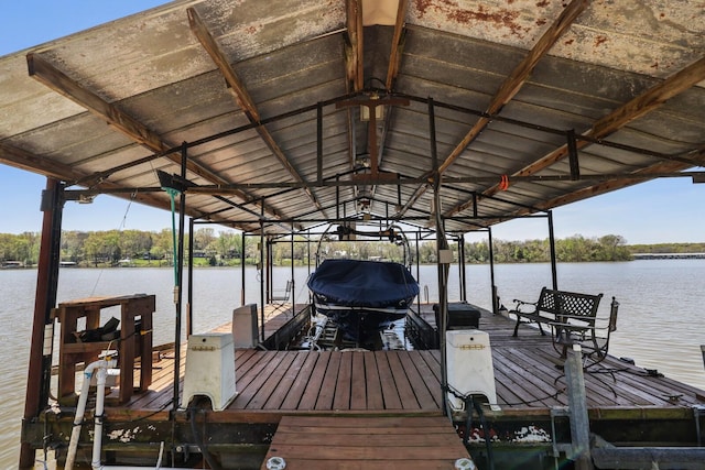 view of dock featuring a water view and boat lift