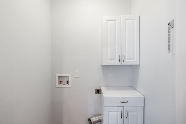 laundry area with hookup for a washing machine, cabinet space, and hookup for an electric dryer
