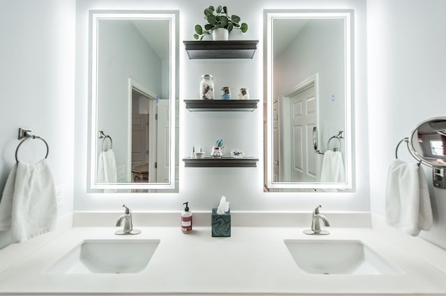 bathroom with double vanity and a sink