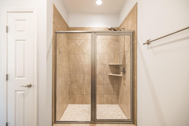 bathroom featuring a shower stall