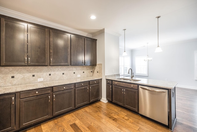 kitchen with tasteful backsplash, a sink, dishwasher, a peninsula, and dark brown cabinets