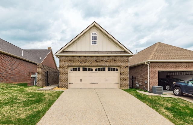 view of front of house featuring cooling unit, board and batten siding, driveway, brick siding, and a garage