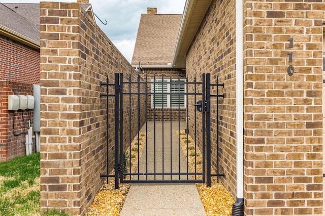 view of gate with fence