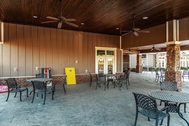 view of patio / terrace with ceiling fan, outdoor dining space, and french doors