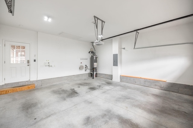 garage featuring water heater, a garage door opener, and electric panel